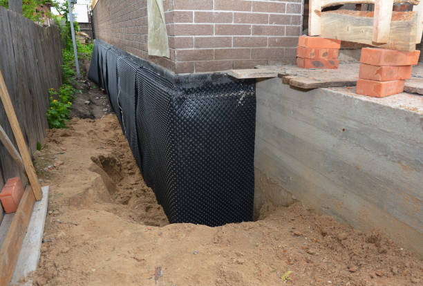 SJ Waterproofing Pros technician performing targeted Waterproofing assessment in Fredericksburg, VA